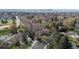 An aerial shot shows the neighborhood with mountains in the background at 2949 Vivian St, Wheat Ridge, CO 80215