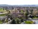An aerial shot shows the neighborhood with mountains in the background at 2949 Vivian St, Wheat Ridge, CO 80215