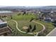 This aerial view highlights a green space with walking trails, enhancing the appeal of community and outdoor recreation at 2949 Vivian St, Wheat Ridge, CO 80215