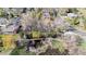 An aerial view shows a home near a creek with a foot bridge at 2949 Vivian St, Wheat Ridge, CO 80215