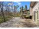 A spacious wooden deck looks into the trees of the backyard at 2949 Vivian St, Wheat Ridge, CO 80215
