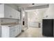 Finished basement featuring neutral paint, cabinets and sink, with overhead ceiling fan at 2949 Vivian St, Wheat Ridge, CO 80215