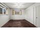 Bedroom with natural light, two windows, neutral walls, and large closets at 2949 Vivian St, Wheat Ridge, CO 80215
