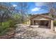 Attached carport to the home with a space to park and picnic table underneath at 2949 Vivian St, Wheat Ridge, CO 80215