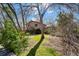 Exterior of a home featuring mature trees and green grass at 2949 Vivian St, Wheat Ridge, CO 80215