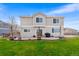 Exterior view of the backyard with a beautiful grass area and a patio at 14803 E 117Th Pl, Brighton, CO 80603