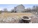 Large backyard featuring a fire pit and exterior view of the home at 14803 E 117Th Pl, Brighton, CO 80603