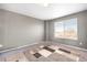 Bright bedroom featuring neutral walls, carpet flooring and a window with natural light at 14803 E 117Th Pl, Brighton, CO 80603