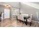 Elegant dining room featuring high ceilings, wood floors, and a stylish table set at 14803 E 117Th Pl, Brighton, CO 80603