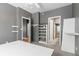 Bedroom with lots of storage and several entry-ways to adjacent rooms at 8055 W Eastman Pl # 104, Lakewood, CO 80227