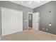 Bedroom showcasing large closet, neutral color palette and two entries at 8055 W Eastman Pl # 104, Lakewood, CO 80227