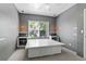 This cozy bedroom offers a large window and a unique platform bed with storage at 8055 W Eastman Pl # 104, Lakewood, CO 80227