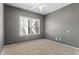 Bedroom featuring natural light with neutral walls, carpet and a ceiling fan at 8055 W Eastman Pl # 104, Lakewood, CO 80227