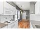Well-equipped kitchen with appliances and access to living area at 8055 W Eastman Pl # 104, Lakewood, CO 80227