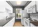 Practical kitchen with white appliances and a window with natural light at 8055 W Eastman Pl # 104, Lakewood, CO 80227