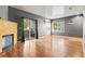 Comfortable living room with a fireplace, sliding glass door, and an adjacent kitchen at 8055 W Eastman Pl # 104, Lakewood, CO 80227