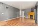 Open living area with hardwood floors, a fireplace, and access to other rooms at 8055 W Eastman Pl # 104, Lakewood, CO 80227