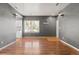 Open living space featuring hardwood floors, a window, and access to the kitchen at 8055 W Eastman Pl # 104, Lakewood, CO 80227