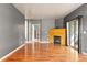 Bright living room showcasing hardwood floors and a fireplace at 8055 W Eastman Pl # 104, Lakewood, CO 80227
