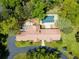 Aerial view of the property highlighting the house, pool, patio, and lush landscaping at 39 Sedgwick Dr, Cherry Hills Village, CO 80113