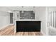 Finished basement bar features modern finishes, open shelving, and stylish pendant lights at 39 Sedgwick Dr, Cherry Hills Village, CO 80113