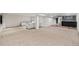 Open basement area with carpet, featuring bar area with tile backsplash and light gray living area at 39 Sedgwick Dr, Cherry Hills Village, CO 80113