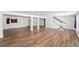 Expansive finished basement featuring hardwood floors, neutral paint, and ample space for entertaining at 39 Sedgwick Dr, Cherry Hills Village, CO 80113