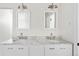 Bright bathroom featuring dual sinks, granite countertops, and modern fixtures at 39 Sedgwick Dr, Cherry Hills Village, CO 80113