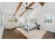 Bright bedroom with wood beams, a ceiling fan, and abundant natural light through large windows at 39 Sedgwick Dr, Cherry Hills Village, CO 80113