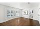 Spacious bedroom showcasing hardwood floors, large bay window, and an ensuite bathroom at 39 Sedgwick Dr, Cherry Hills Village, CO 80113