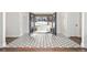 Grand foyer with patterned tile flooring and double doors opening to the outdoors at 39 Sedgwick Dr, Cherry Hills Village, CO 80113