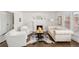 Chic living room with a fireplace, stylish seating, and hardwood floors at 39 Sedgwick Dr, Cherry Hills Village, CO 80113