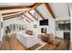 Inviting living room boasts wood beams, fireplace, and ample natural light at 39 Sedgwick Dr, Cherry Hills Village, CO 80113