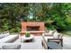 Beautiful outdoor brick fireplace with ample seating, perfect for cozy evenings at 39 Sedgwick Dr, Cherry Hills Village, CO 80113