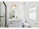 Bright bathroom with a glass shower, modern vanity, and a large window with outside views at 421 Saint Paul St, Denver, CO 80206