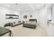 Modern bedroom with neutral decor, a gray sofa, and contemporary artwork at 421 Saint Paul St, Denver, CO 80206