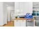 Butler's pantry features ample storage with a beverage center and wood countertops at 421 Saint Paul St, Denver, CO 80206