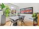 Dining room featuring a large window with hardwood floors and views of the neighborhood at 421 Saint Paul St, Denver, CO 80206