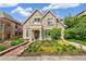 Stunning stone home with a landscaped front yard, walkway, and inviting entrance at 421 Saint Paul St, Denver, CO 80206