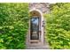 Welcoming front door framed by lush greenery with clear door number visibility at 421 Saint Paul St, Denver, CO 80206