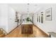 Sleek, modern kitchen with a large island, stainless steel appliances, and ample natural light at 421 Saint Paul St, Denver, CO 80206