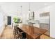 Spacious open-concept kitchen with large island, stainless steel appliances, and hardwood floors at 421 Saint Paul St, Denver, CO 80206
