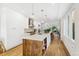 Open kitchen featuring an island with white countertops and hardwood floors at 421 Saint Paul St, Denver, CO 80206