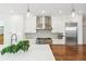 Bright kitchen with white cabinets, stainless steel appliances, and a striking butcher block island at 421 Saint Paul St, Denver, CO 80206