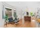 Open-concept living space, featuring hardwood floors with access to kitchen and dining at 421 Saint Paul St, Denver, CO 80206