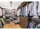 Organized walk-in closet with custom shelving and storage drawers for clothes and shoes at 421 Saint Paul St, Denver, CO 80206