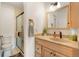 Bathroom with modern vanity, granite countertop, stylish fixtures, and glass-enclosed shower at 10520 W 101St Pl, Westminster, CO 80021