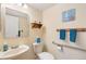 Cozy bathroom featuring a pedestal sink, decorative ocean-themed decor, and accessibility features at 10520 W 101St Pl, Westminster, CO 80021