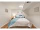 Cozy bedroom with comfortable bed, paneled walls, and stylish decor for a relaxing retreat at 10520 W 101St Pl, Westminster, CO 80021