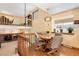 Charming dining area with hardwood floors, chandelier, and lots of natural light at 10520 W 101St Pl, Westminster, CO 80021